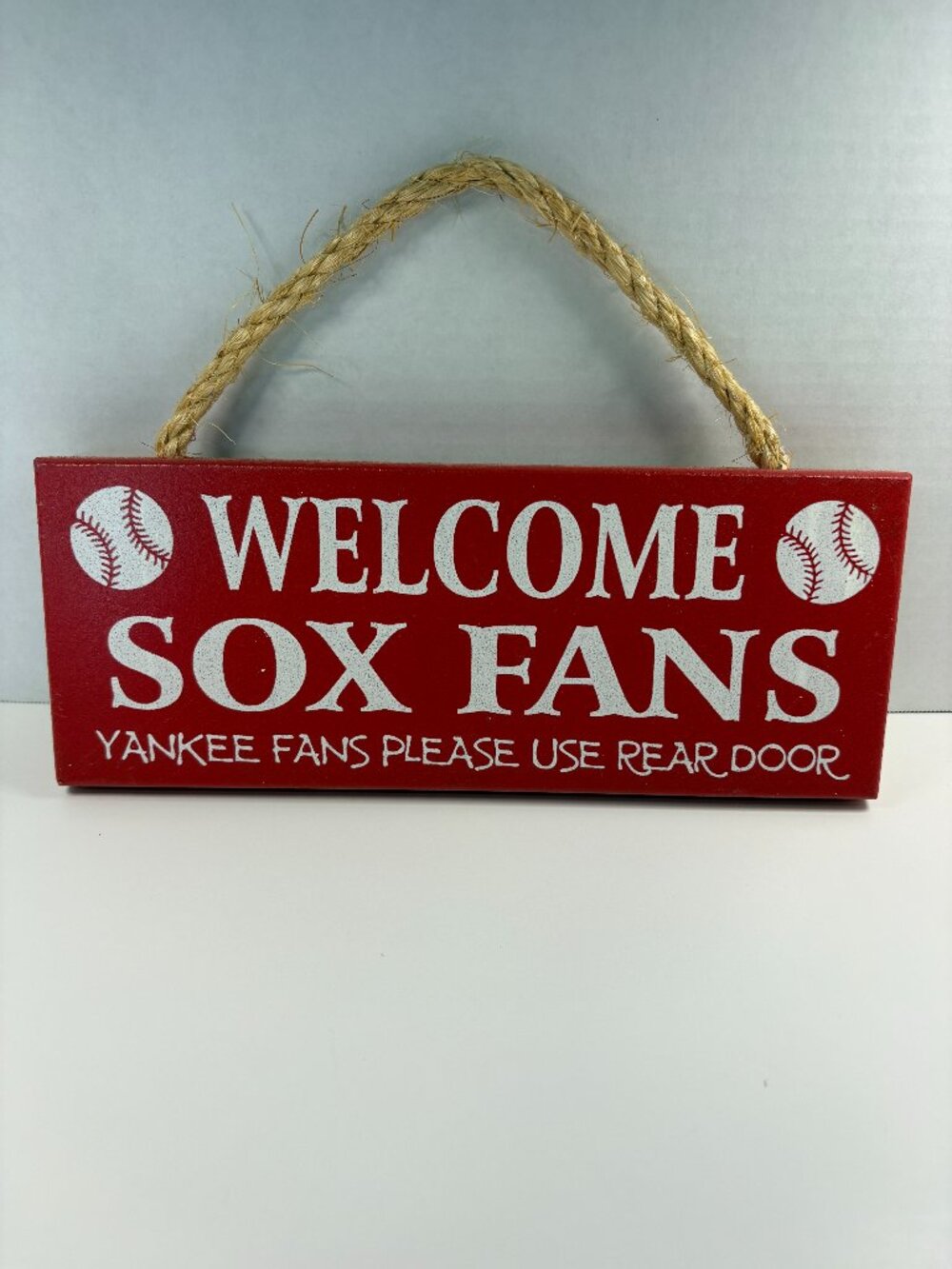 Boston Red Sox Fan Sign; New York Yankees use the rear door